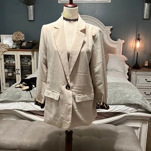 Tan with cheetah print on the cuffs.  Jackets are in this fall ladies!